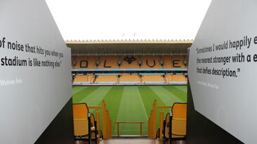Printed wall graphics leading to pitch side at Wolves football stadium